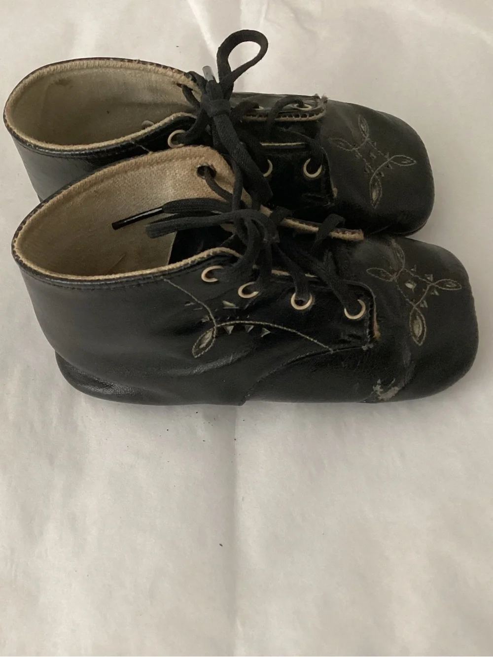 Antique high-top black glazed leather baby shoe, lace-up likely dating from 1920